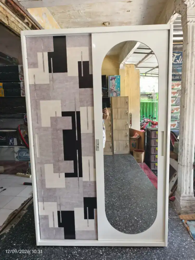 Lemari besi pintu geser 120x50x185 motif Madiun kota