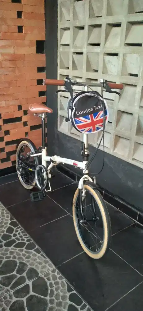 london taxi sepeda lipat