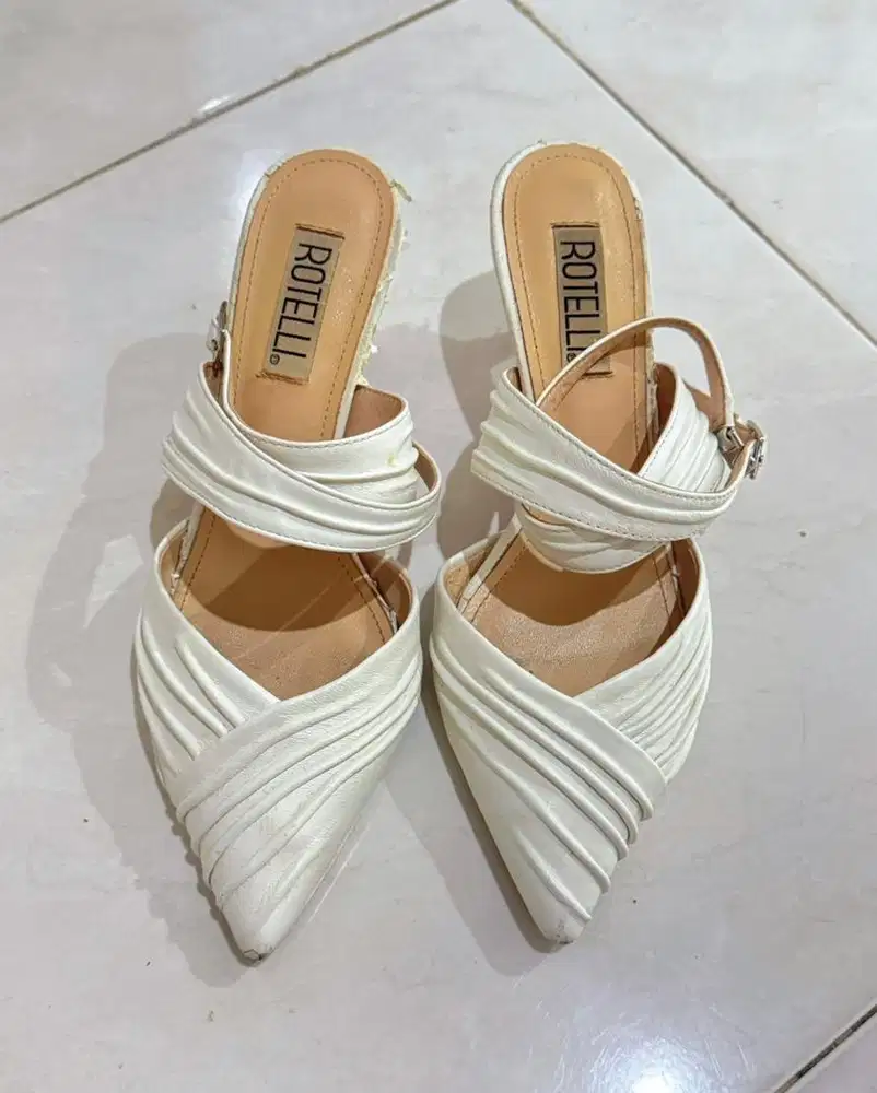 Rotelli white pleated pointed-toe kitten heel mules with ankle straps.