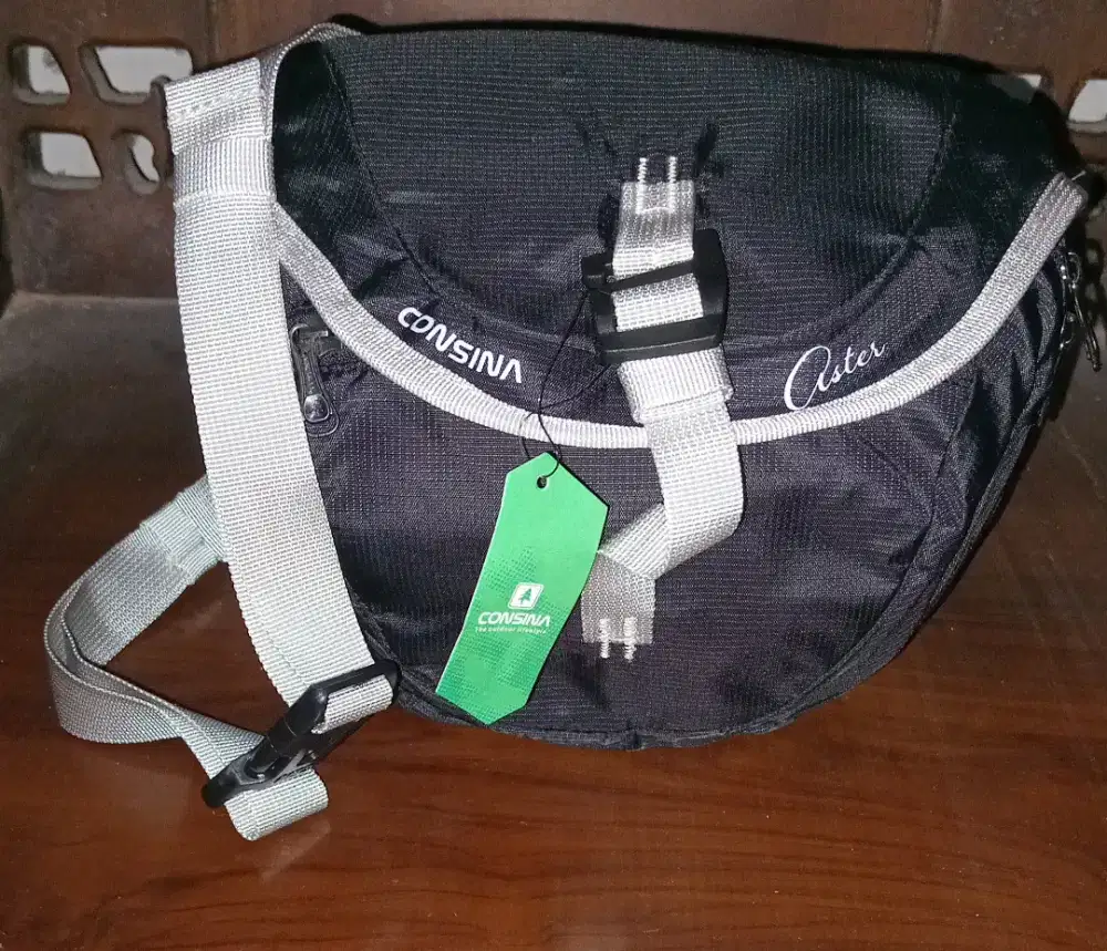 Tas slempang consina,new ori  hitam,nominus ,lok jln godean