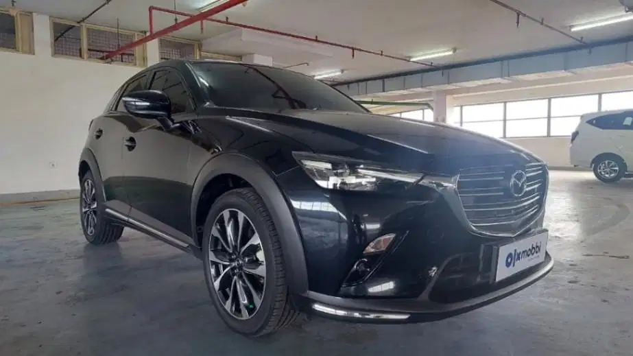 DP 12 JT Mazda CX-3 1.5 Sport Bensin-AT Hitam 2021