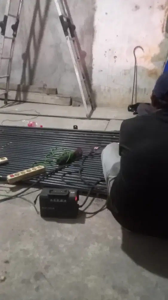 Tukang reparasi service rolling door folding gate murah