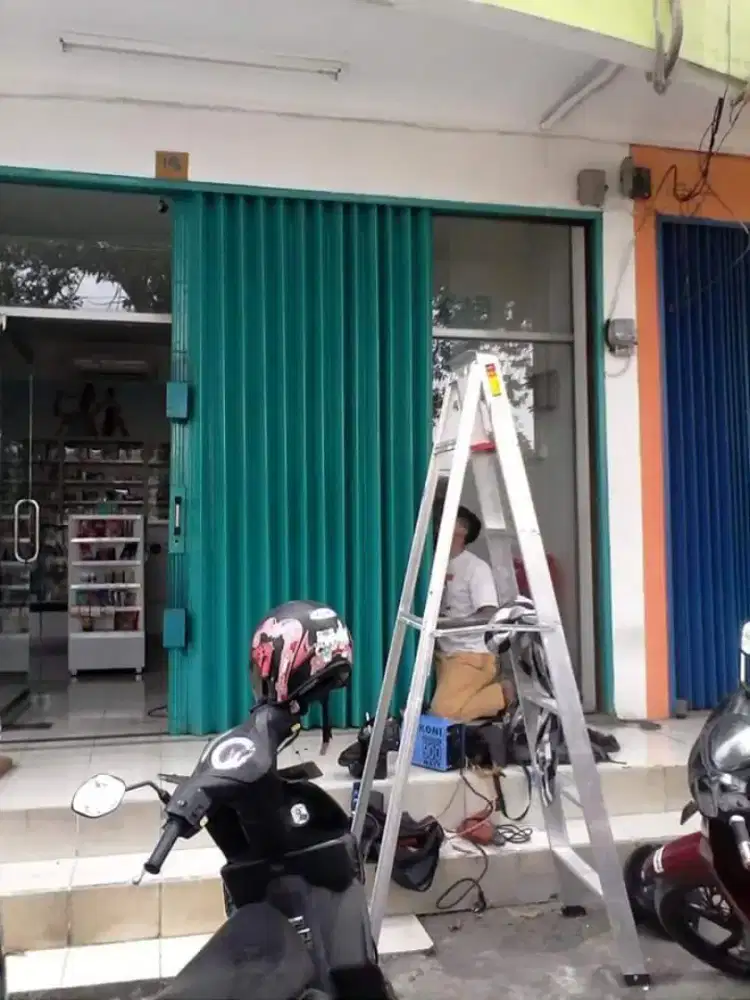 Tukang perbaikan service rolling door folding gate murah