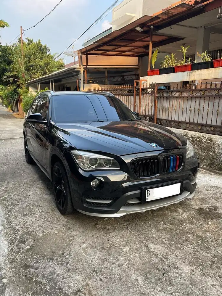 BMW X1 SDRIVE AUTOMATIC  HITAM TAHUN 2014