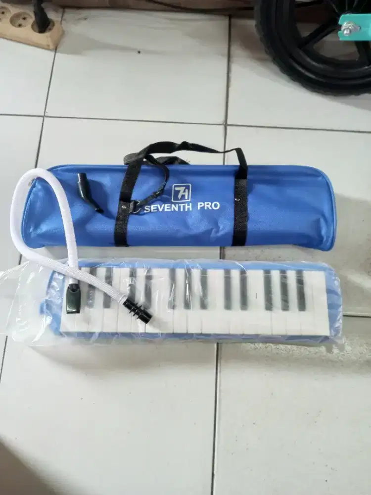 mainan anak pianika tiup