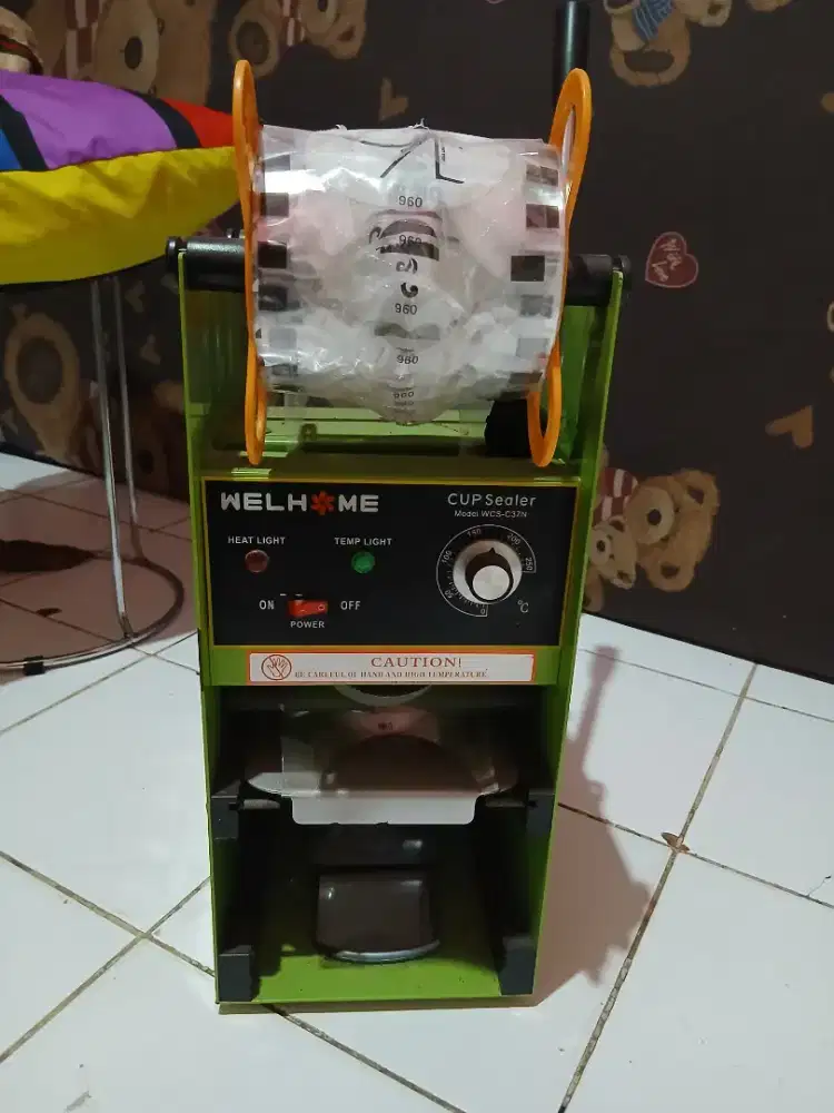 Mesin pres es teh