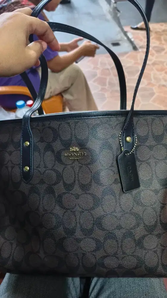Tas coach Made in Vietnam