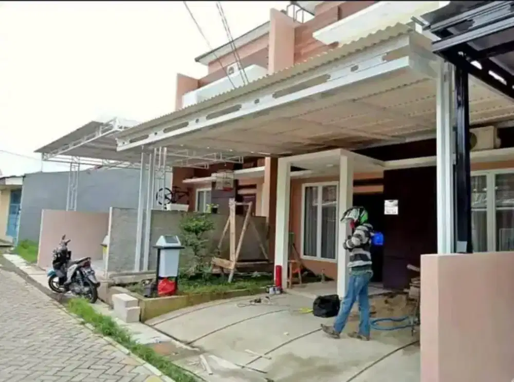 Pemasangan kanopi rumah rangka baja ringan atap spandek polos