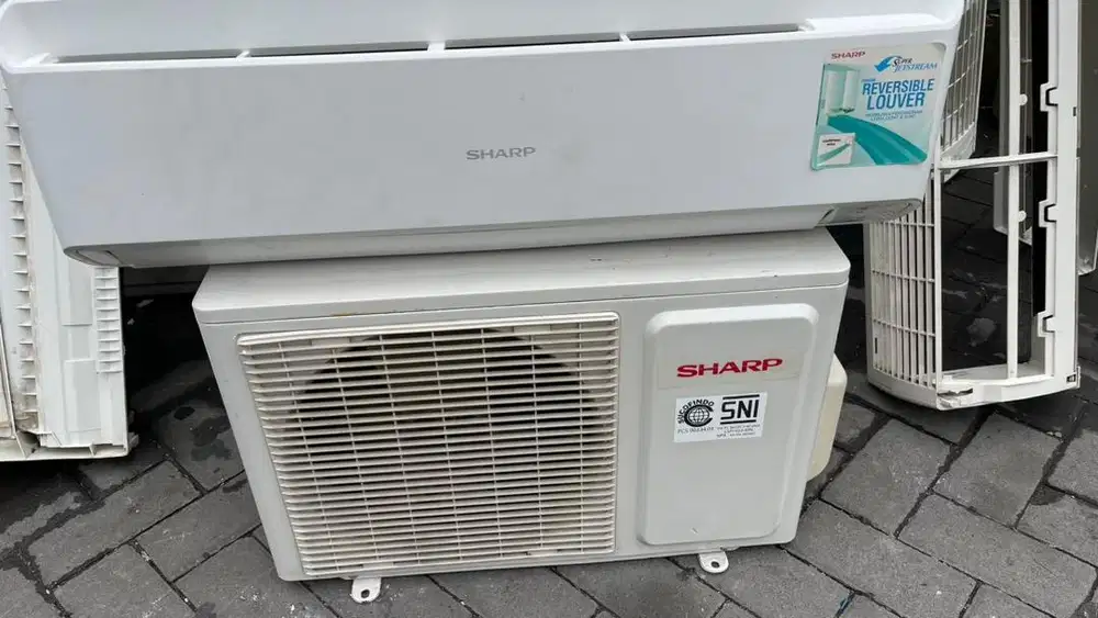 AC 1/2 PK sahrp harga plus pasang garansi 6 bulan