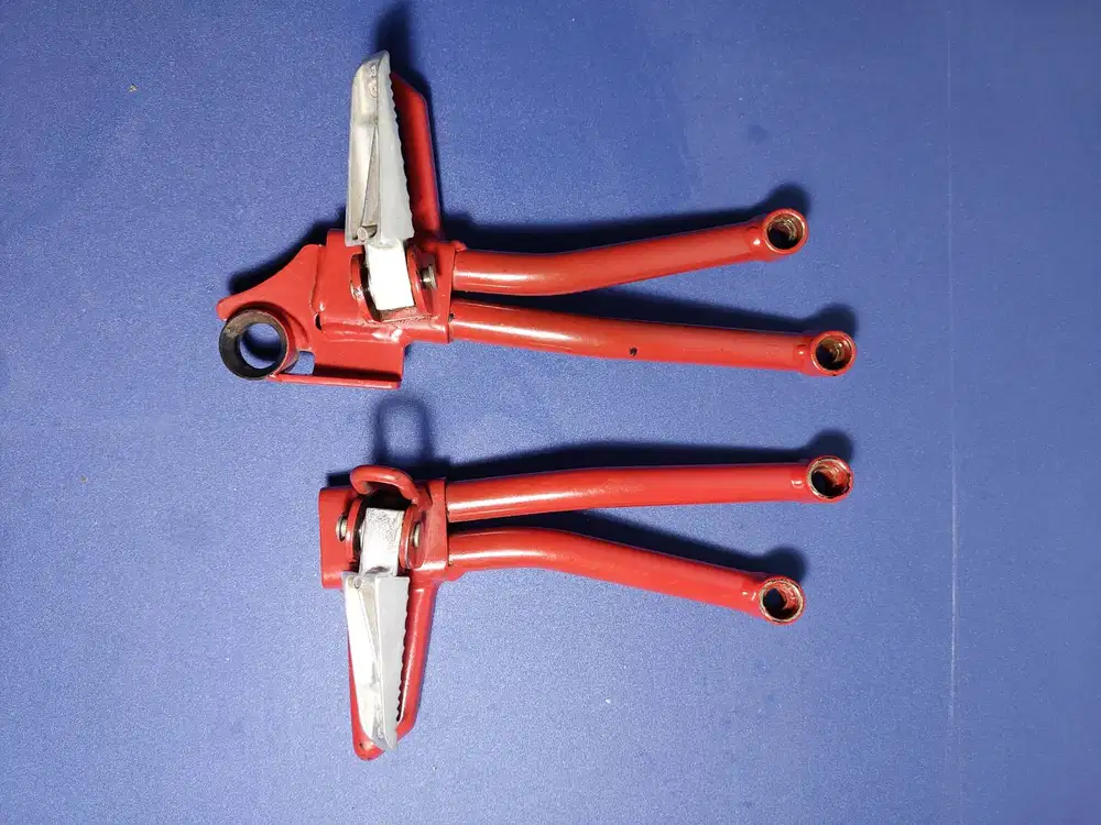 Rearstep GSX 150, warna merah, buat siluet motor lebih macho