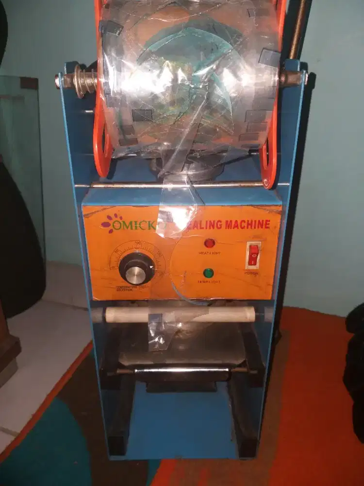Sealing machine merek omicko
