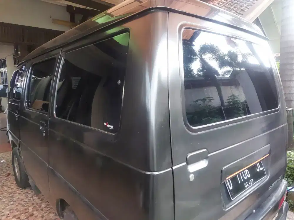 kaca film mobil dan gedung panggilan