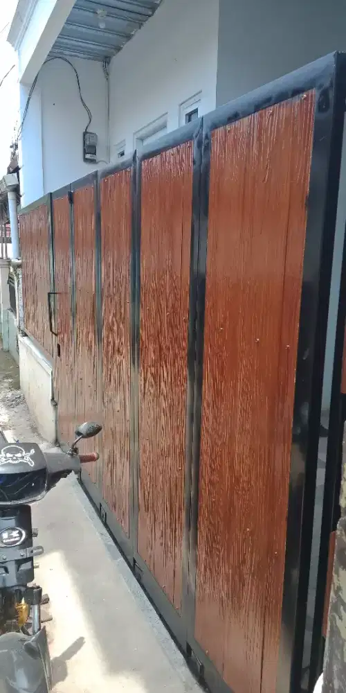 Pagar pintu rumah sleding tikung