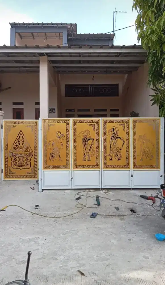 Pagar cutting motif wayang