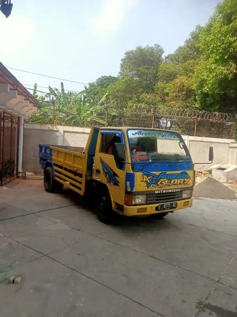 Buang puing tanah urugan