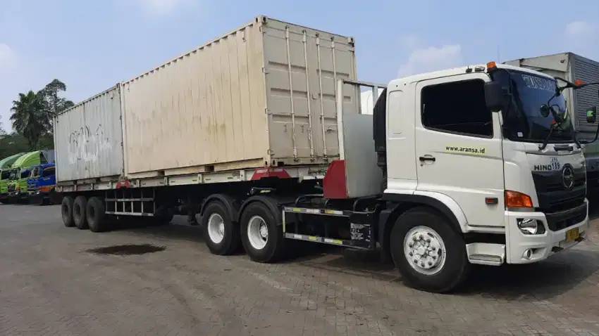 Jasa kirim barang trailer flat bed 12 meter semua kota di Pulau Jawa