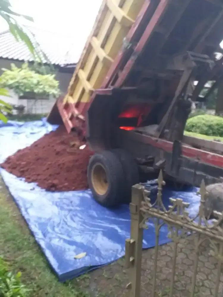 Pengurugan urug buang puing sampah urugan puing tanah merah campur