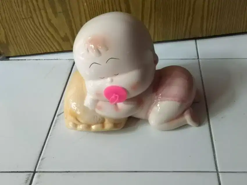 celengan bayi tidur