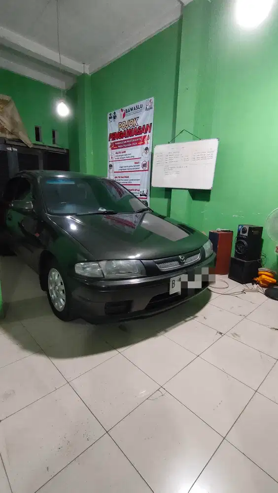 Mazda 323 1998 Bensin