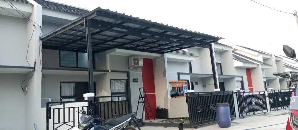 Pemasangan kanopi rumah rangka baja ringan atap spandek pasir