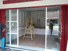 Partisi alumunium kaca pintu lipat dan geser perumahan kavling toko
