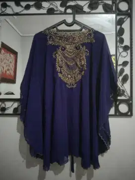 Kaftan wanita ungu