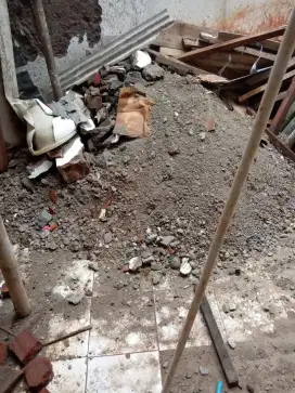 Pengurugan urug buang puing sampah urugan puing tanah merah campur