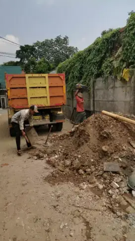 Puing tanah merah tanah campur pengurugan urug buang puing sampah