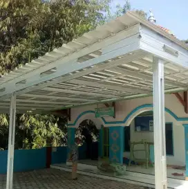 Pemasangan kanopi rumah rangka baja ringan atap spandek pasir