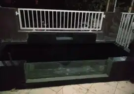 Kolam ikan terbuat dari bahan batu alam yang di coating warna hitam