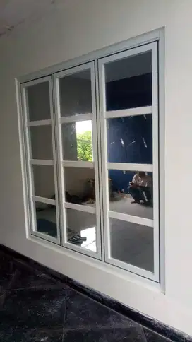 pembuatan pintu aluminium urat kayu spesialis Kusen Alumunium