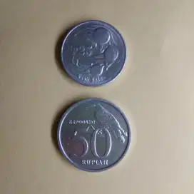 Koin perak Rp 25 dan Rp 50