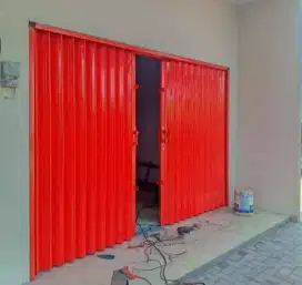 Folding gate roling door
