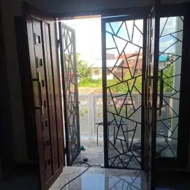 Pintu pengaman kombinasi plat lobang,motif abstrak mewah