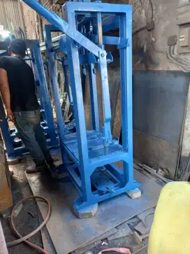 Mesin Press Cetak Batu Tela