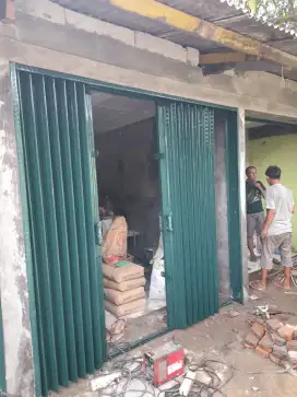 Folding gate rolling door