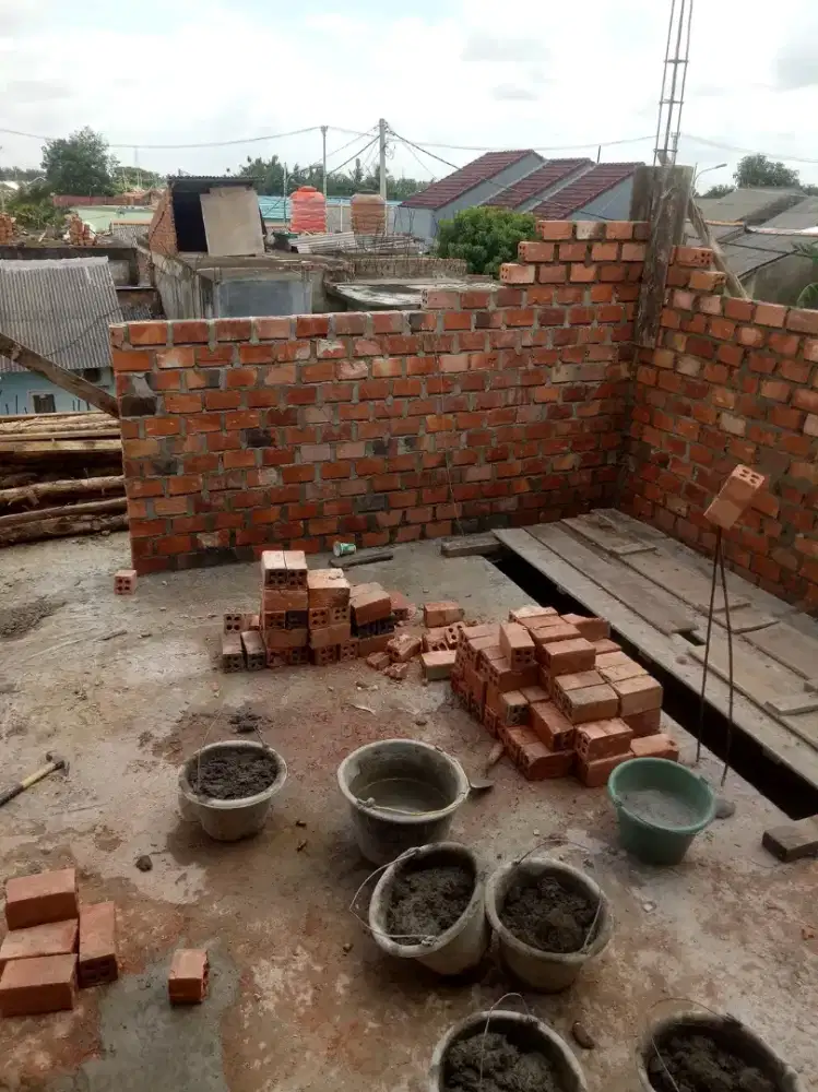 Tukang bangunan harian / borongan