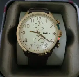 Jam fossil analog coklat emas