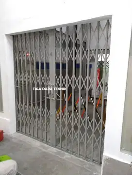 Pasang Service harmonika gudang, garasi, pintu ruko dll tigadarateknik