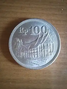 Uang koin RI 100 rupiah tebal tahun 1973.