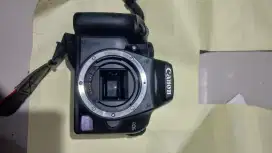 Canon 1000D body +charger + tas NORMAL