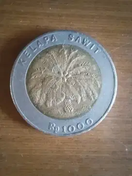 Uang koin RI 100 rupiah kelapa sawit tahun 2000.