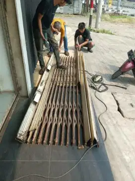 tukang service rolling door murah