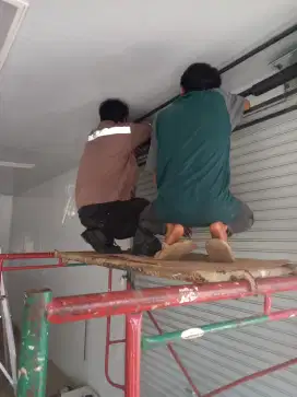 Perbaikan pintu rolling door murah