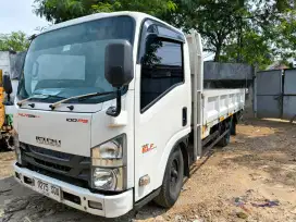 Isuzu nmr giga 100 ps engkel 4roda bak besi cargo tahun 2019