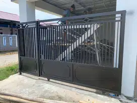 Pintu pagar minimalis besi hollo