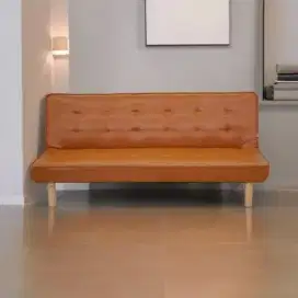 Obral sofa tidur kulit