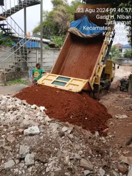 Urugan puing tanah merah campur pengurugan urug buang puing sampah