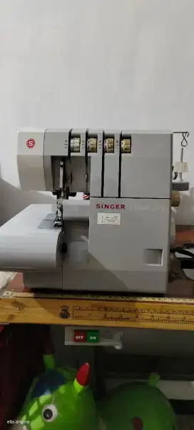 Mesin jahit obras neci portabel singer