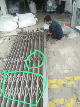 Spesialis servis rolling door bergaransi